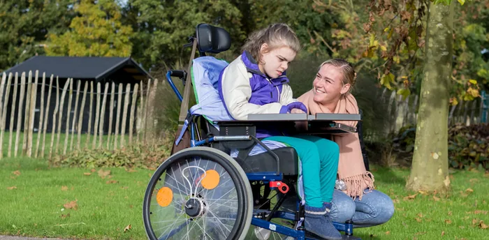 Two people talking with a blue foreground overlay